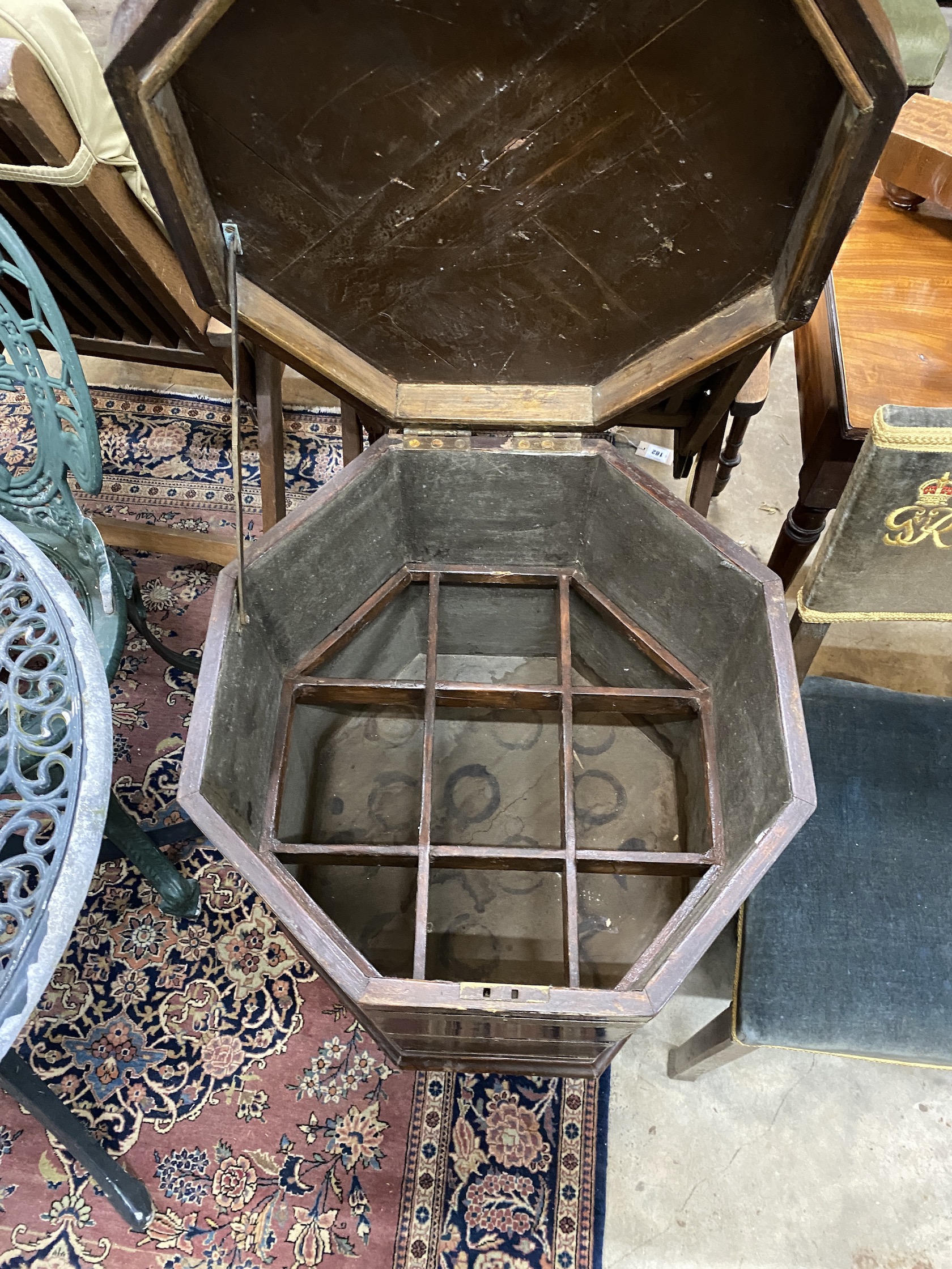 A George III style brass bound octagonal oak cellarette, width 49cm, height 78cm
